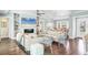 Light-filled living room with a fireplace, built-in shelving, and comfortable seating at 510 Wedge Ln, Longboat Key, FL 34228