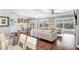Living room with an adjacent kitchen and backyard views of a pool at 510 Wedge Ln, Longboat Key, FL 34228