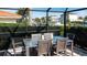 Outdoor patio with glass table for six and waterway views at 510 Wedge Ln, Longboat Key, FL 34228