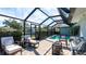 Enclosed patio with brick flooring, a pool, and elegant outdoor furniture offers comfort and style at 510 Wedge Ln, Longboat Key, FL 34228