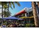 Outdoor seating at Cilantro Grill, a vibrant setting beneath red awnings, perfect for enjoying casual dining at 510 Wedge Ln, Longboat Key, FL 34228