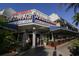 Charming Columbia Restaurant exterior with outdoor seating and vibrant signage, a culinary landmark since 1905 at 510 Wedge Ln, Longboat Key, FL 34228