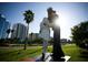 Close-up of the Unconditional Surrender statue with sunny skies and nearby landscaping at 510 Wedge Ln, Longboat Key, FL 34228