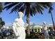 Street view featuring a statue and nearby businesses, with tropical landscaping at 510 Wedge Ln, Longboat Key, FL 34228