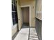 Small balcony with an open storage closet, offering practical outdoor space and additional storage at 5146 Northridge Rd # 310, Sarasota, FL 34238