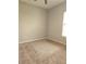 Simple bedroom featuring neutral carpet and natural light, creating a calm and inviting atmosphere at 5146 Northridge Rd # 310, Sarasota, FL 34238
