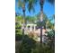 Resort-style community pool with shady pergolas, mature landscaping and plenty of seating for residents at 5146 Northridge Rd # 310, Sarasota, FL 34238