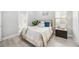This cozy bedroom offers soft natural light, plush textures and soft decor at 5328 Brookgrove Dr, Sarasota, FL 34238