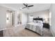 Spacious bedroom with a cozy bed, soft lighting, and convenient access to an en-suite bathroom at 5328 Brookgrove Dr, Sarasota, FL 34238