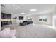 Large bonus room with carpet, wet bar, mounted television, and comfortable sectional sofa at 5328 Brookgrove Dr, Sarasota, FL 34238