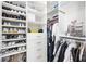 A walk-in closet featuring built-in shelving, drawers, and plenty of storage space at 5328 Brookgrove Dr, Sarasota, FL 34238