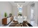 Dining area showcases modern design with a glass table and a bright airy atmosphere with views to the exterior at 5328 Brookgrove Dr, Sarasota, FL 34238