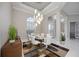 Stylish dining area with a modern chandelier, clear view to entry and other rooms of the house at 5328 Brookgrove Dr, Sarasota, FL 34238