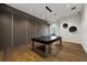 Game room with a ping pong table, contemporary lighting, and a sleek design, ideal for entertainment at 5328 Brookgrove Dr, Sarasota, FL 34238