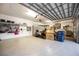 A spacious garage with an epoxy floor, storage cabinets and organizational options for parking and hobbies at 5328 Brookgrove Dr, Sarasota, FL 34238
