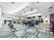 Well-equipped gym with modern fitness equipment, ceiling fans, and large windows for ample natural light at 5328 Brookgrove Dr, Sarasota, FL 34238