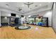 Spacious gym area with hardwood floors, fitness equipment, and exercise space, promoting a healthy lifestyle at 5328 Brookgrove Dr, Sarasota, FL 34238