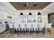 Gourmet kitchen with a large island, pendant lighting, stainless steel appliances, and ample seating at 5328 Brookgrove Dr, Sarasota, FL 34238