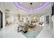 Open-concept living area with tile flooring, modern decor, and a seamless flow to the kitchen and dining spaces at 5328 Brookgrove Dr, Sarasota, FL 34238