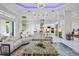 Spacious living room featuring stylish furnishings and decor with great flow into the kitchen and dining areas at 5328 Brookgrove Dr, Sarasota, FL 34238