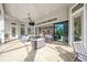 Versatile outdoor space with comfortable seating, a view to the kitchen, and covered patio at 5328 Brookgrove Dr, Sarasota, FL 34238