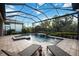 Relaxing backyard pool with chaise lounges and screened-in lanai at 5328 Brookgrove Dr, Sarasota, FL 34238