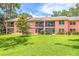 Condo with screened-in patios overlooking a lush, expansive green backyard at 5500 Longwood Run Blvd # 203, Sarasota, FL 34243