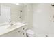 Bathroom featuring a shower, toilet, and single sink vanity with cabinets at 5500 Longwood Run Blvd # 203, Sarasota, FL 34243