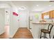 Bright open kitchen featuring modern appliances and a breakfast bar with stool seating at 5500 Longwood Run Blvd # 203, Sarasota, FL 34243