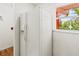Bright kitchen featuring a large white refrigerator and a view from the window at 5500 Longwood Run Blvd # 203, Sarasota, FL 34243