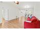 Open floor plan with updated floors and a kitchen bar, perfect for entertaining guests at 5500 Longwood Run Blvd # 203, Sarasota, FL 34243