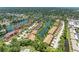 Overhead view of residential community near a lake and featuring lush tropical trees and manicured landscaping at 5728 Ashton Lake Dr # 12, Sarasota, FL 34231