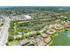 Panoramic aerial shot of a community with scenic water features, pools and lush landscaping at 5728 Ashton Lake Dr # 12, Sarasota, FL 34231