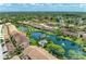 Breathtaking aerial view featuring lush greenery, serene lakefront properties, and charming architecture at 5728 Ashton Lake Dr # 12, Sarasota, FL 34231