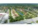 Overhead view of a community featuring ponds, lush greenery, and well-manicured lawns, near a highway at 5728 Ashton Lake Dr # 12, Sarasota, FL 34231