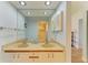 Ensuite bathroom featuring double sinks and plenty of storage at 5728 Ashton Lake Dr # 12, Sarasota, FL 34231