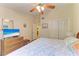 Bedroom showcasing a TV on a dresser, closet and art at 5728 Ashton Lake Dr # 12, Sarasota, FL 34231