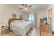 Bedroom with a ceiling fan and two dressers, offering a cozy and functional space at 5728 Ashton Lake Dr # 12, Sarasota, FL 34231