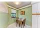 Cozy breakfast nook with a small table, two chairs, and a bright window at 5728 Ashton Lake Dr # 12, Sarasota, FL 34231