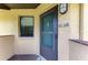 Close-up of the front door with clear unit number and a window, providing natural light at 5728 Ashton Lake Dr # 12, Sarasota, FL 34231