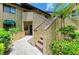Exterior of condo building featuring well-maintained landscaping and clear unit number at 5728 Ashton Lake Dr # 12, Sarasota, FL 34231