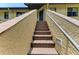 Inviting brick steps leading to the upper level of the condo building at 5728 Ashton Lake Dr # 12, Sarasota, FL 34231