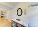 Hallway featuring coastal-themed decor and a glimpse into other living spaces at 5728 Ashton Lake Dr # 12, Sarasota, FL 34231