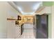 Efficient kitchen with white tile floors, stainless refrigerator and cabinets at 5728 Ashton Lake Dr # 12, Sarasota, FL 34231