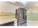 Cozy kitchen featuring a stainless steel refrigerator and plenty of storage at 5728 Ashton Lake Dr # 12, Sarasota, FL 34231