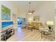 Bright living room with comfortable seating, neutral decor, and a sliding glass door at 5728 Ashton Lake Dr # 12, Sarasota, FL 34231