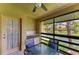 Relaxing patio with a table and seating overlooking a serene lake view at 5728 Ashton Lake Dr # 12, Sarasota, FL 34231