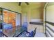 Outdoor patio blending function and relaxation with views into the living spaces at 5728 Ashton Lake Dr # 12, Sarasota, FL 34231
