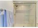 Walk-in shower features clean white tile and glass door at 5728 Ashton Lake Dr # 12, Sarasota, FL 34231