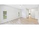 Bedroom with hardwood floors, neutral walls, large windows, and natural light at 6107 Misty Oaks St, Sarasota, FL 34243
